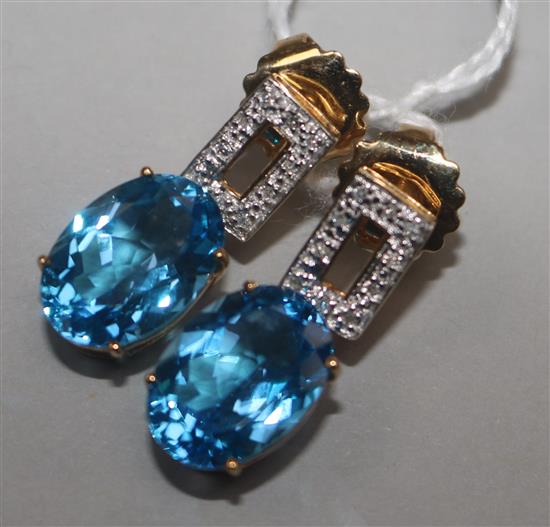 A modern pair of 14ct gold, blue topaz and diamond set drop earrings, 25mm.
